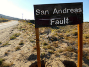 Roadsign of San Andreas Fault twisted and broken.