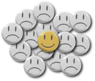 Smiley face buttons. Frowns in gray and smiley face button in yellow on top.