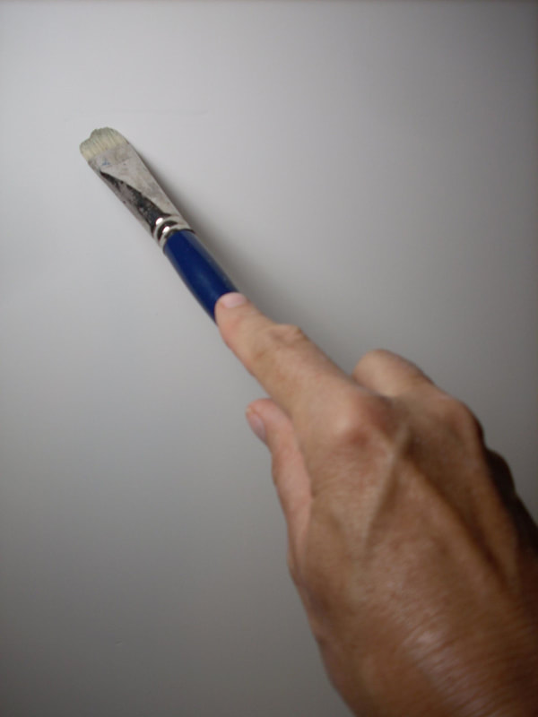 Artist holding a brush On Side