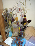 Paint brushes standing on an artist's table